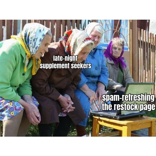 F5 Until Restock — Four grandmothers huddle around a laptop at 3AM, embodying every peptide buyer waiting for the vendor's inventory to tick from 'sold out' to 'add to cart.'